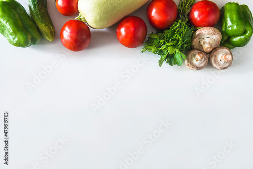 Vegan eating concept; Frame of fresh ripe vegetables on white background; space for text