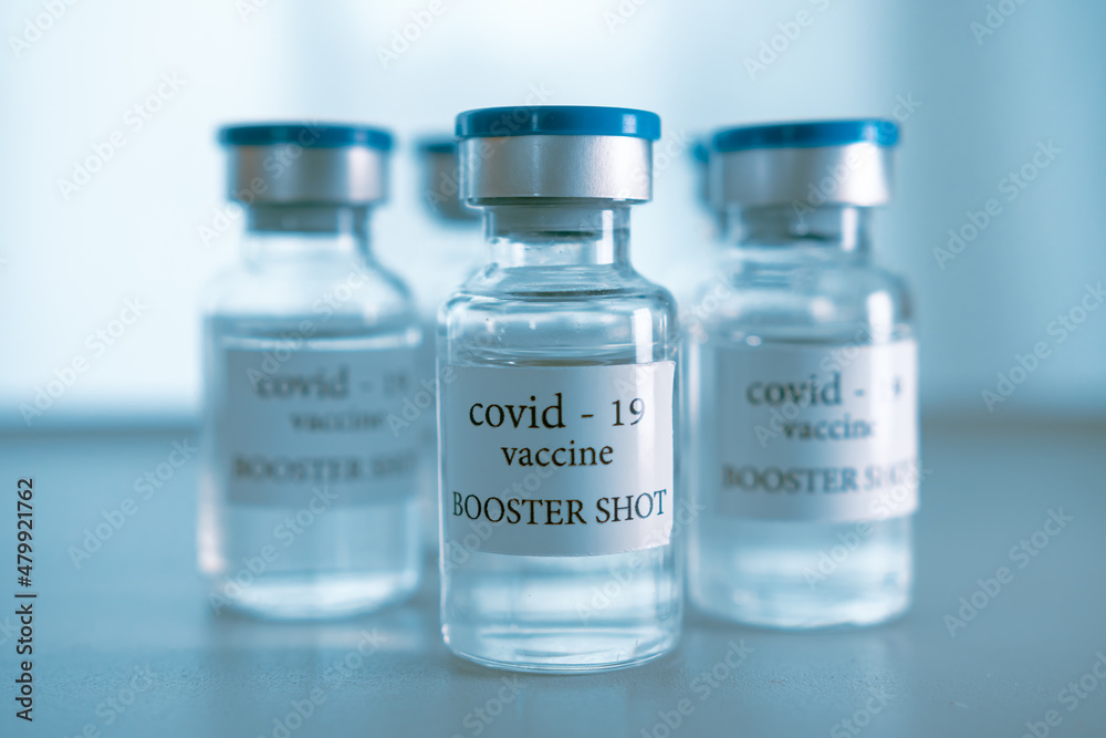 COVID-19 booster vaccine vial. Medicine and health care concept COVID-19 booster vaccine vial. Medicine and health care concept