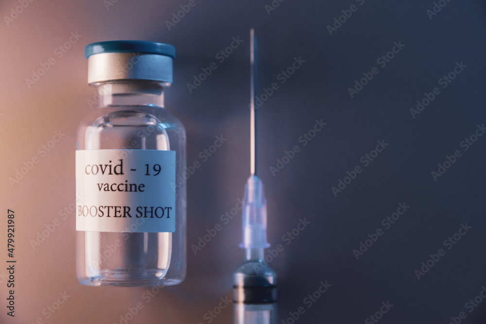 COVID-19 booster vaccine vial. Medicine and health care concept COVID-19 booster vaccine vial. Medicine and health care concept