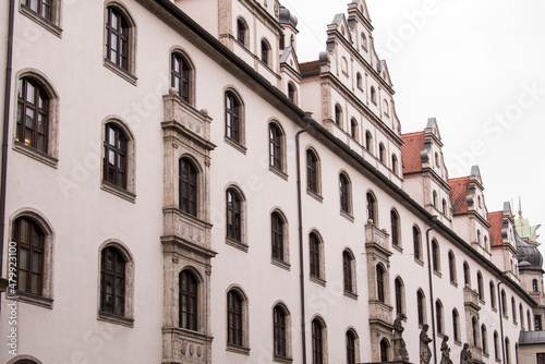 Munich, Germany - December 19 2021: Street view of The facade of the building in Munich downtown on Winter day. 