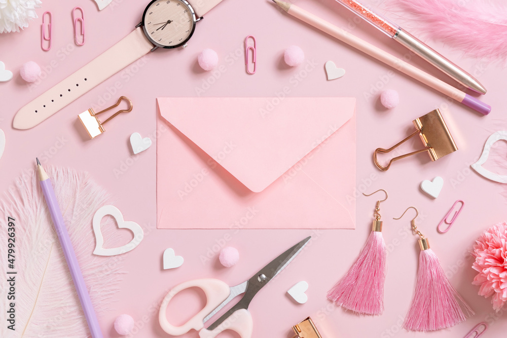 Pink envelope, school girly accessories and hearts on pastel pink top view, mockup Pink envelope, school girly accessories and hearts on pastel pink top view, mockup
