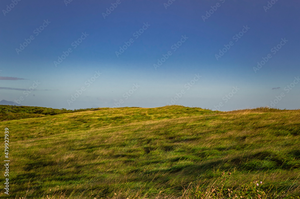 picture of a hill with clouds and blue sky, picture of a hill with blue sky in the background picture of a hill with clouds and blue sky, picture of a hill with blue sky in the background
