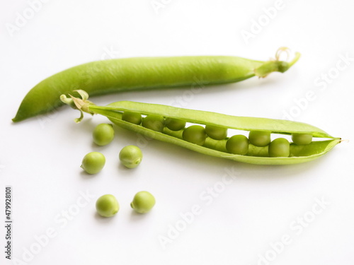Фотография Peas in pod isolated on white background, on table