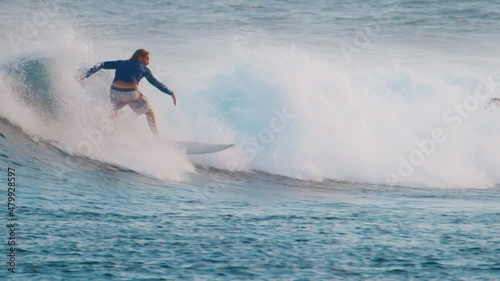 Man surfs the wave in the ocean. Sultans surf spot in Maldives