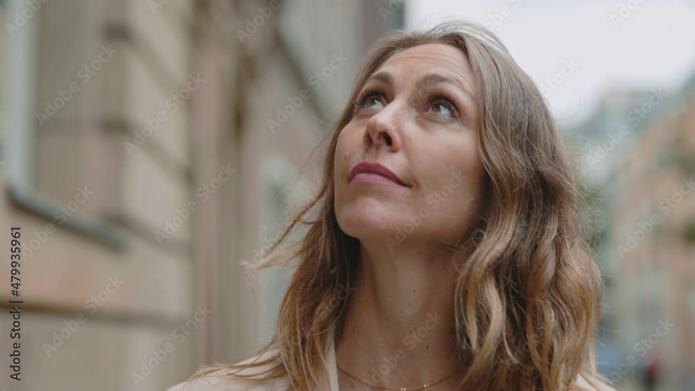 Attractive middle aged woman walking alone outdoors Attractive middle aged woman walking alone outdoors