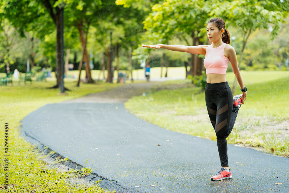 asian young woman stretching in park, lifestyle and health concept.
