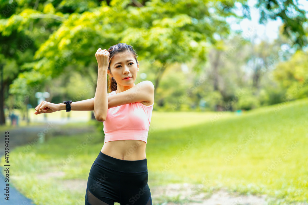 asian young woman stretching in park, lifestyle and health concept. asian young woman stretching in park, lifestyle and health concept.