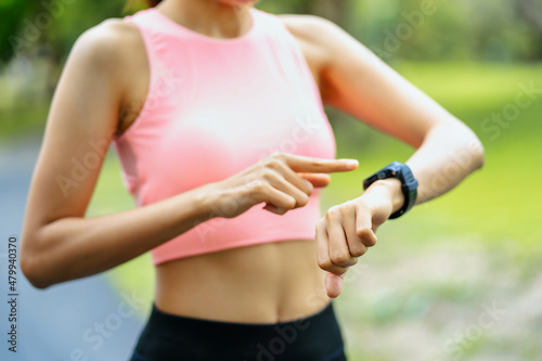 asian young woman stretching exercises use sport watch, Sports healthy lifestyle concepts.