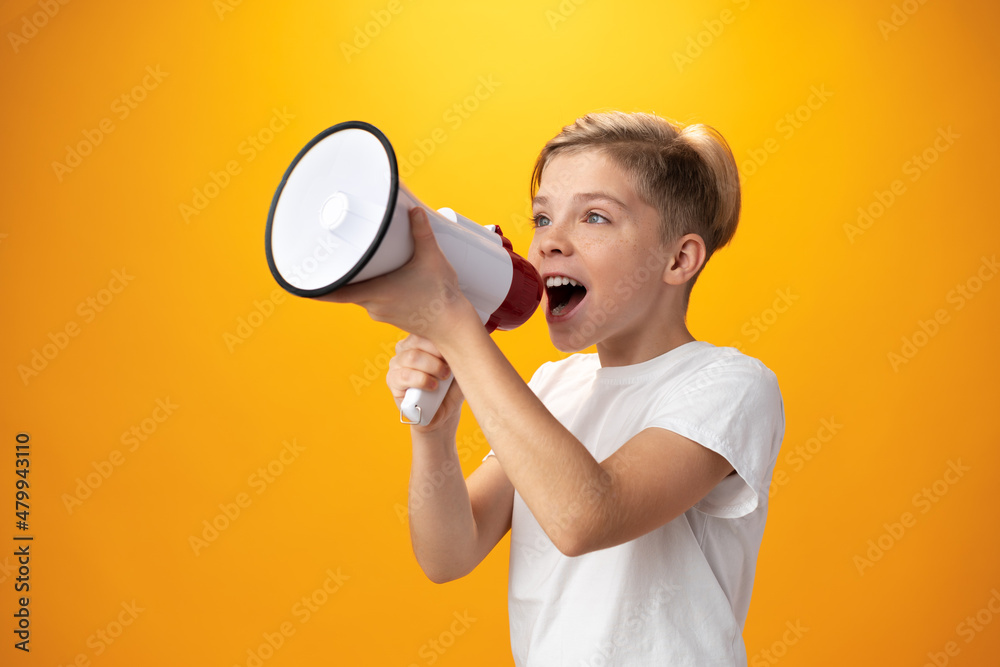 Little boy with megaphone on yellow background Little boy with megaphone on yellow background