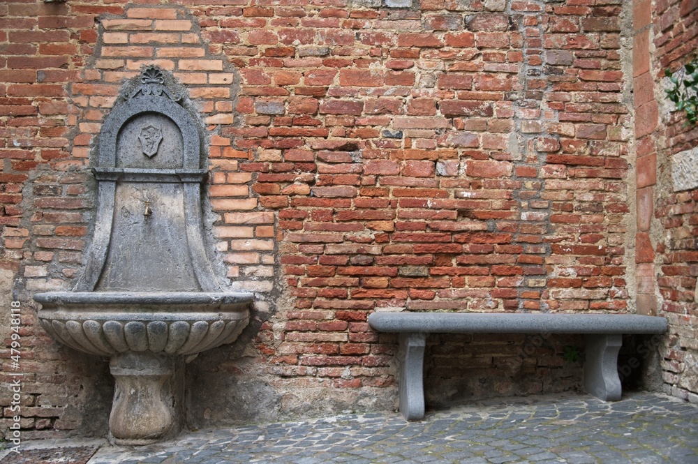 Ancient Fountain in a Medieval Village in Italy Ancient Fountain in a Medieval Village in Italy