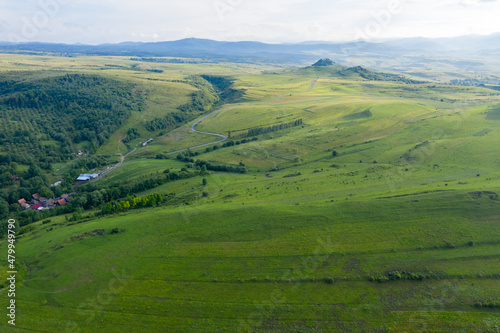 Aerial view of countryside vibrant green hills. Transylvania, Romania