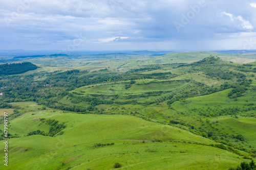Aerial view of countryside vibrant green hills. Transylvania  Romania