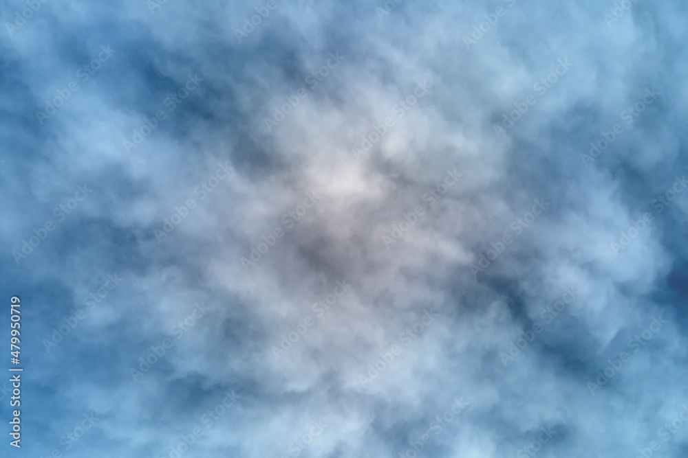 Aerial view from high altitude of earth covered with puffy rainy clouds forming before rainstorm