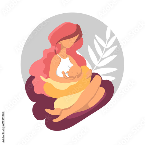 Woman breastfeeding her newborn baby in cross-cradle position. photo