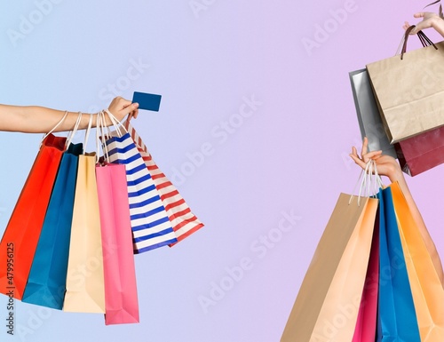 Shopping therapy. Contemporary art collage of three female hands with shopping bags