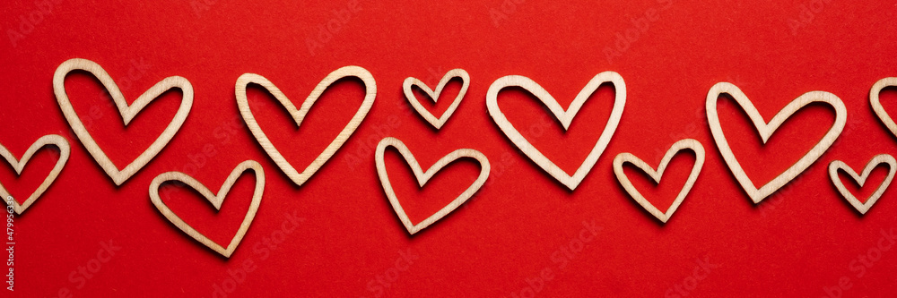 Beautiful card with valentine wooden hearts on red background for decorative design. Nature concept. Wedding card decoration. Happy valentine day background. Beautiful card with valentine wooden hearts on red background for decorative design. Nature concept. Wedding card decoration. Happy valentine day background.
