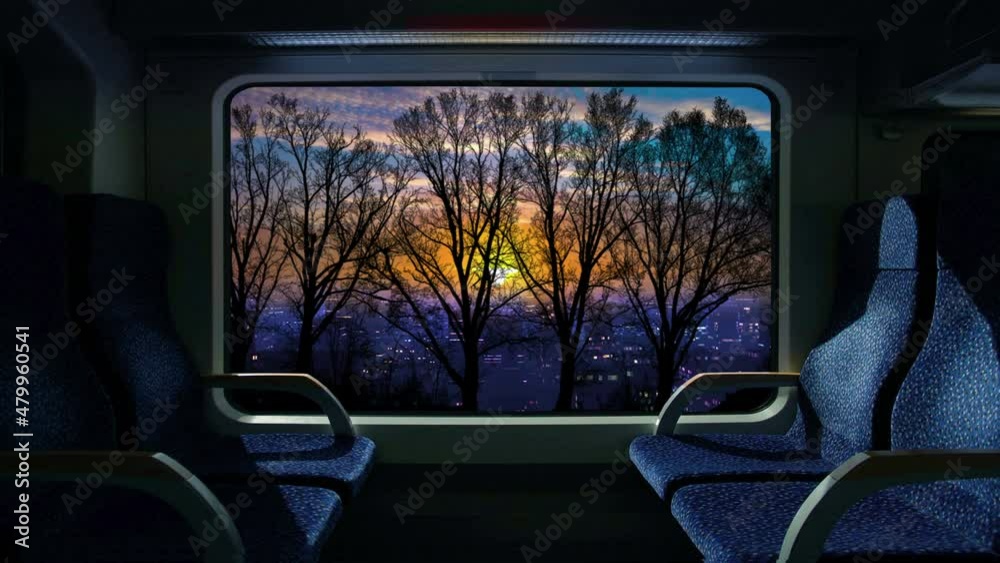 Train compartment window. 4K. Loop. Sunrise or sunset on a train journey.