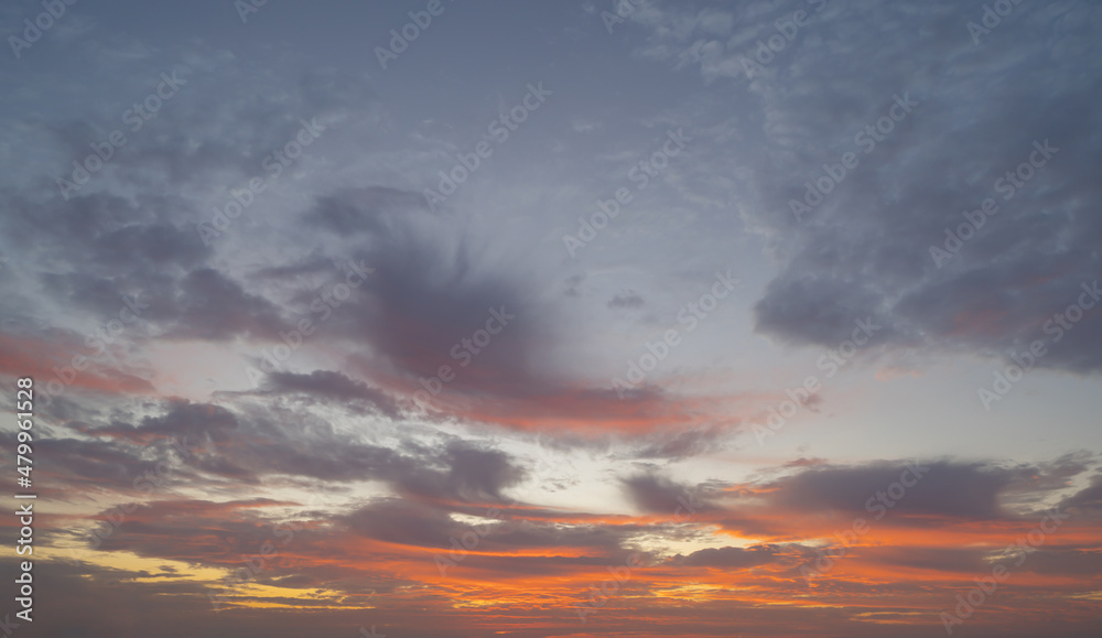 Sunset sky. Abstract nature background. Dramatic blue with orange colorful clouds in twilight time. Sunset sky. Abstract nature background. Dramatic blue with orange colorful clouds in twilight time.