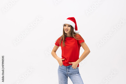 portrait of a smiling beautiful happy woman in christmas santa hat isolated on white background. © F8  \ Suport Ukraine