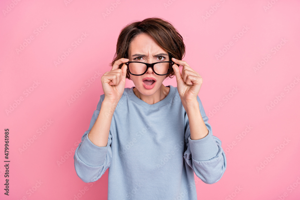 Photo of sad young brunette lady look camera wear eyewear blue sportscloth isolated on pink color background Photo of sad young brunette lady look camera wear eyewear blue sportscloth isolated on pink color background