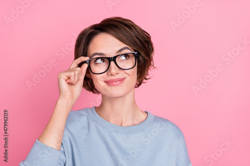 Photo of sweet young brunette lady look promo wear eyewear blue sportscloth isolated on pink color background