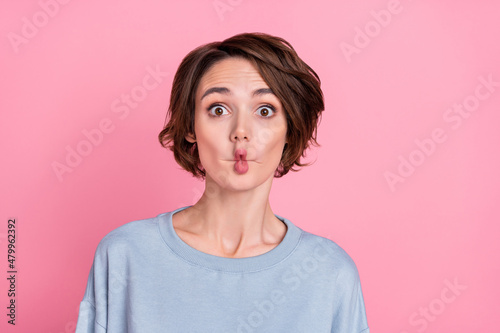 Photo of funny young bob hairdo lady play wear blue sportscloth isolated on pink color background