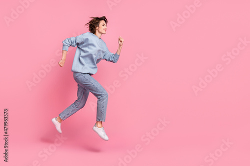 Full size photo of impressed young lady run wear jumper jeans shoes isolated on pink background