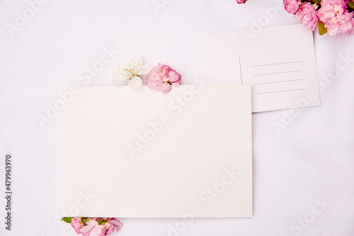 Obraz na płótnie Spring delicate post card with place for address and stationery card mock up with pink and white flowers. Woman's day, invitation, romantic, wedding, birthday, Mother's day card concept. Copy space. w salonie