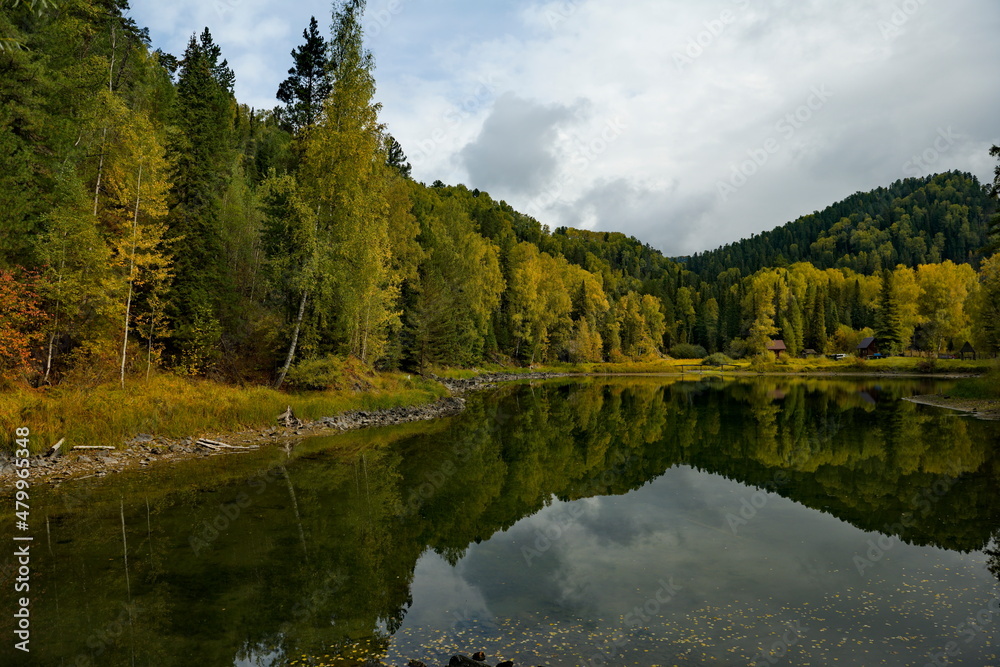 Russia. South of Western Siberia, Mountain Altai. Early autumn on the shore of Lake Teletskoye near the tourist village of Artybash. Russia. South of Western Siberia, Mountain Altai. Early autumn on the shore of Lake Teletskoye near the tourist village of Artybash.