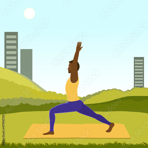 African American man doing yoga, standing in Warrior 1 (Virabhadrasana I) posture outside the city