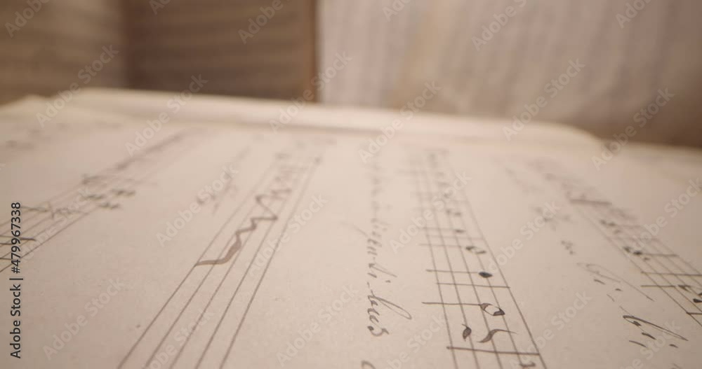 Music Sheet, Musical notes - Close Up Shot. Tracking Macro Shot on a music sheet.