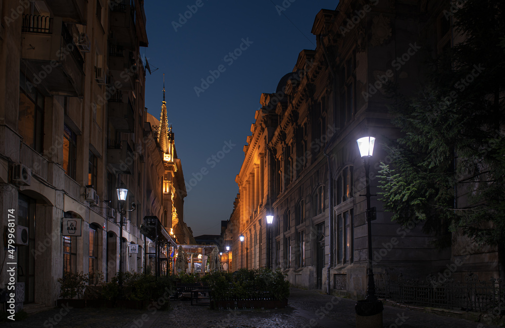 Landmarks of Bucharest. Historical buildings from the Old Town photographed during the night. Romania, 2021.