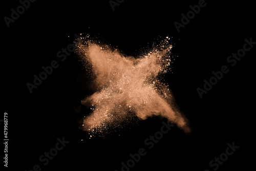 Fotografija Closeup of orange dust particle splash isolated on black   background