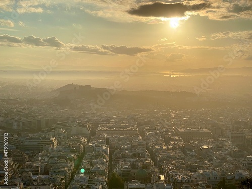 sunset above the misty acropolis
