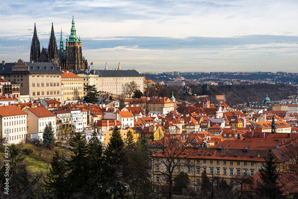 Prague city view with historical buildings. Scenic aerial view of the Old Town architecture. Picturesque landscape with old houses with red tiled roofs.