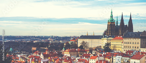 Colorful cityscape roofs. Castle Saint Vitus Cathedral on the background. Prague, Czech Republic. Vintage toned image.