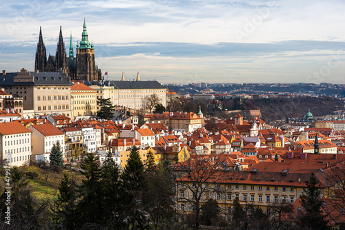 Prague city view with historical buildings. Scenic aerial view of the Old Town architecture. Picturesque landscape with old houses with red tiled roofs. © eskstock