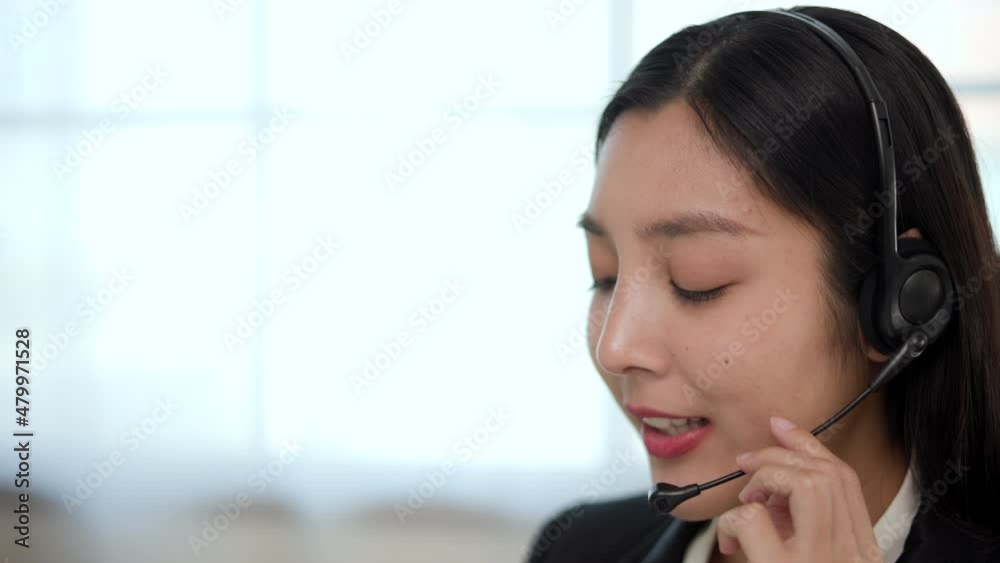 Call center smiley asian business woman receptionist wear headphone video conference calling on computer talk by webcam in online chat, customer support service. Call center smiley asian business woman receptionist wear headphone video conference calling on computer talk by webcam in online chat, customer support service.
