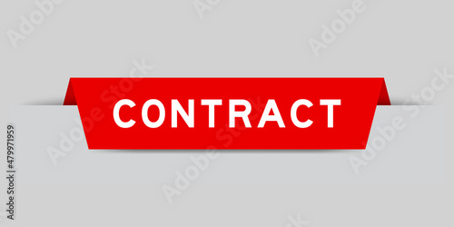 Red color inserted label with word contract on gray background