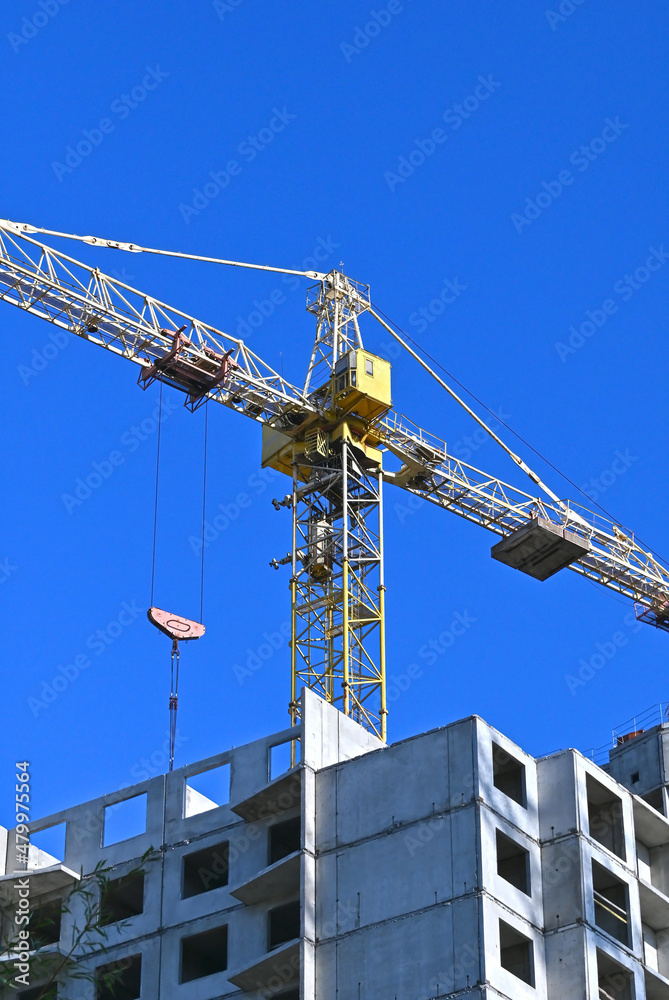 Crane and highrise construction site Crane and highrise construction site