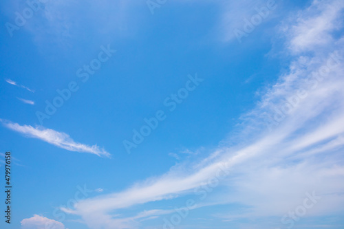 White clouds on the blue sky for background.