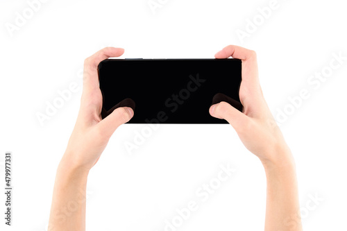 Woman hand holding black smartphone with blank screen isolated on white background.