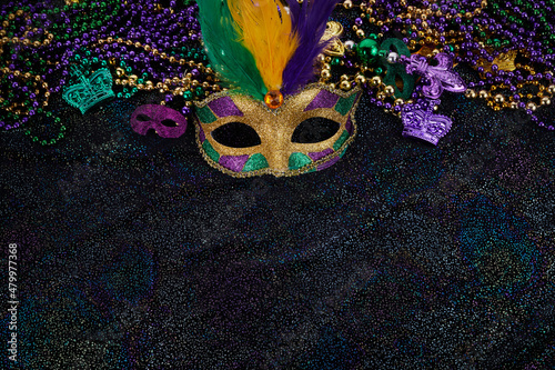 Mardi Gras Mask and colorful Mardi Gras Beads Background photo