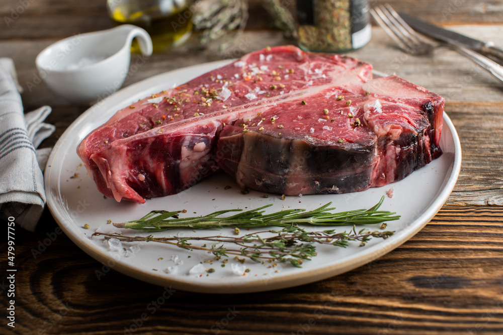 Dry aged t-bone steak with salt and pepper