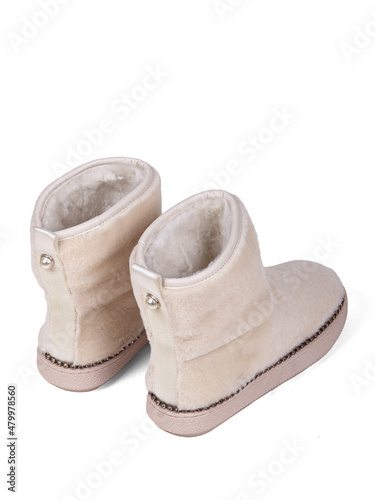 White winter woman's boots with fur on a white background