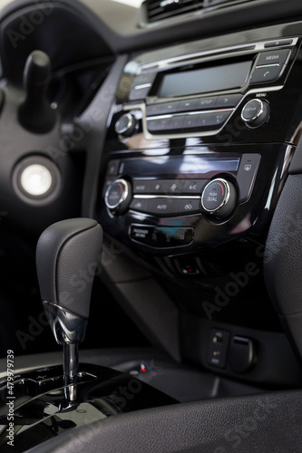 Interior of new modern unknown car with automatic transmission in dealer showroom. Modern transportation. © tikhomirovsergey