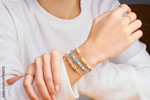 Bracelets. Unisex gold bracelet on woman hand