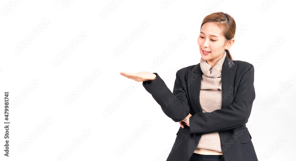 Portrait asian woman in suit showing open hand with copy space for your advertisement or promotional text . Portrait asian woman in suit showing open hand with copy space for your advertisement or promotional text .