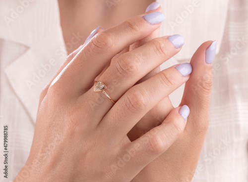 Diamond jewelry. Diamond ring on woman hand