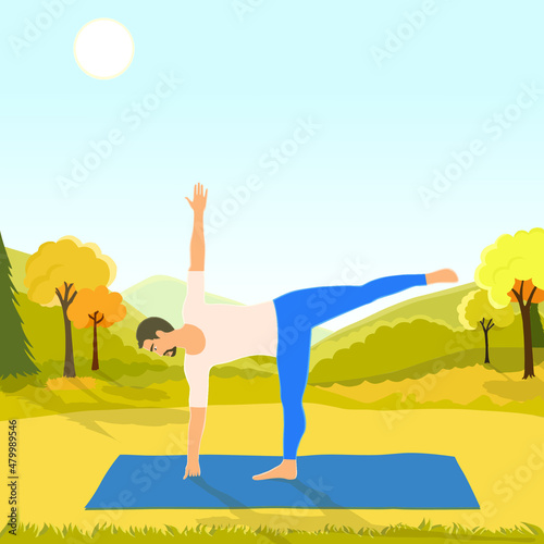 Young sporty man practicing yoga, standing in extended triangle pose, working out, doing exercises outside at the beautiful park at sunny day photo